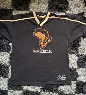 Y2K DASH Genuine Defined Apparel Africa Graphic V-Neck